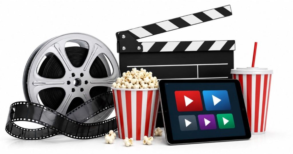 May 2026 theatre and OTT releases editorial illustration featuring film reel, clapperboard, popcorn and streaming platform visuals on white background