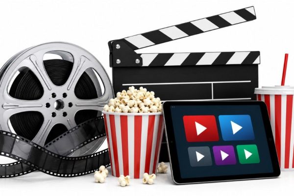 May 2026 theatre and OTT releases editorial illustration featuring film reel, clapperboard, popcorn and streaming platform visuals on white background